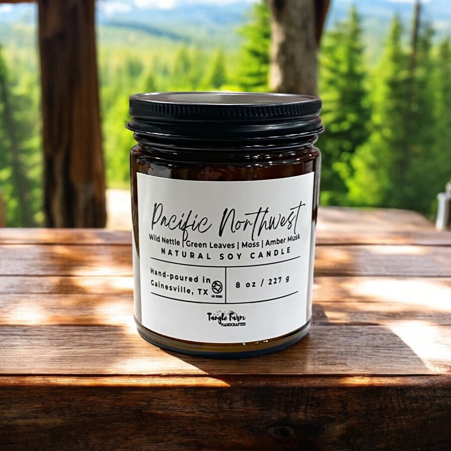 Pacific Northwest 8oz soy candle scented with notes of wild nettle, green leaves, moss, amber musk.