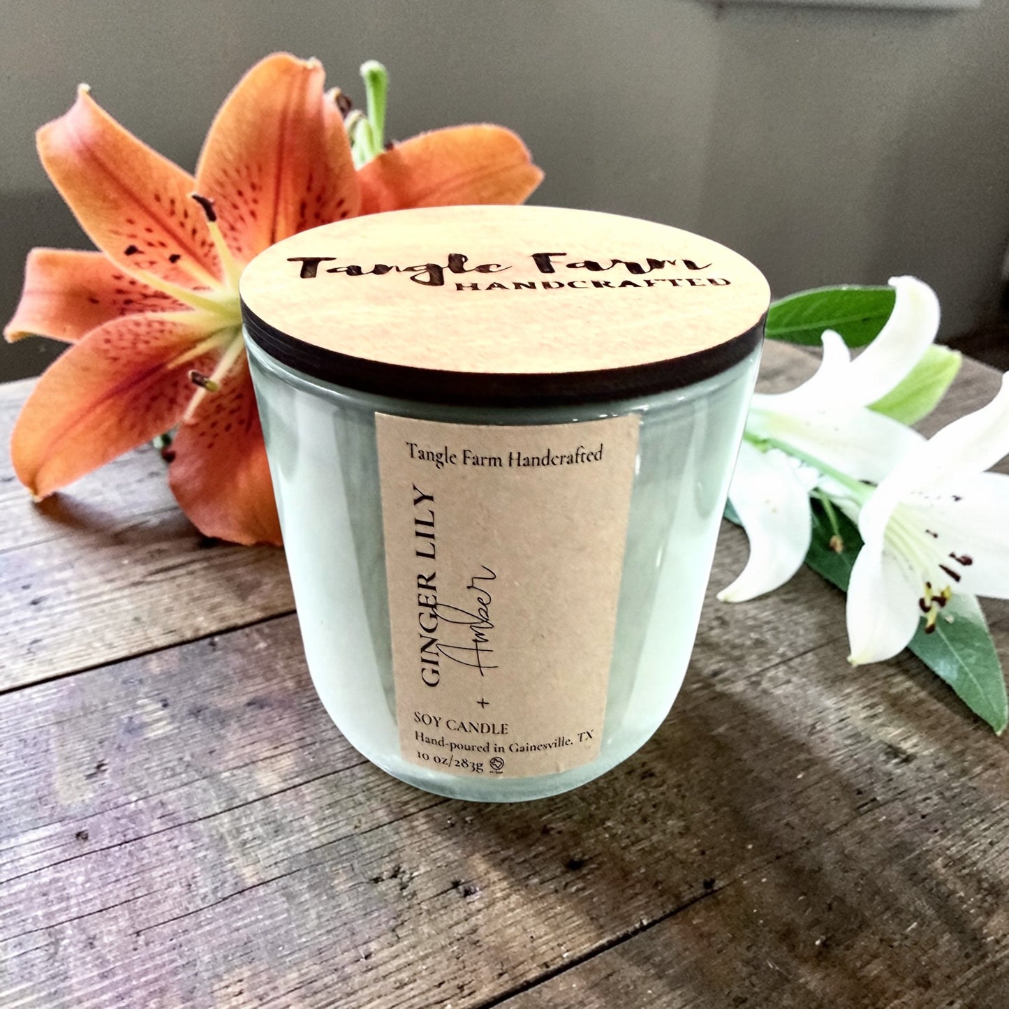 Ginger lily and amber soy candle in a colorful Serafina container, 10oz.