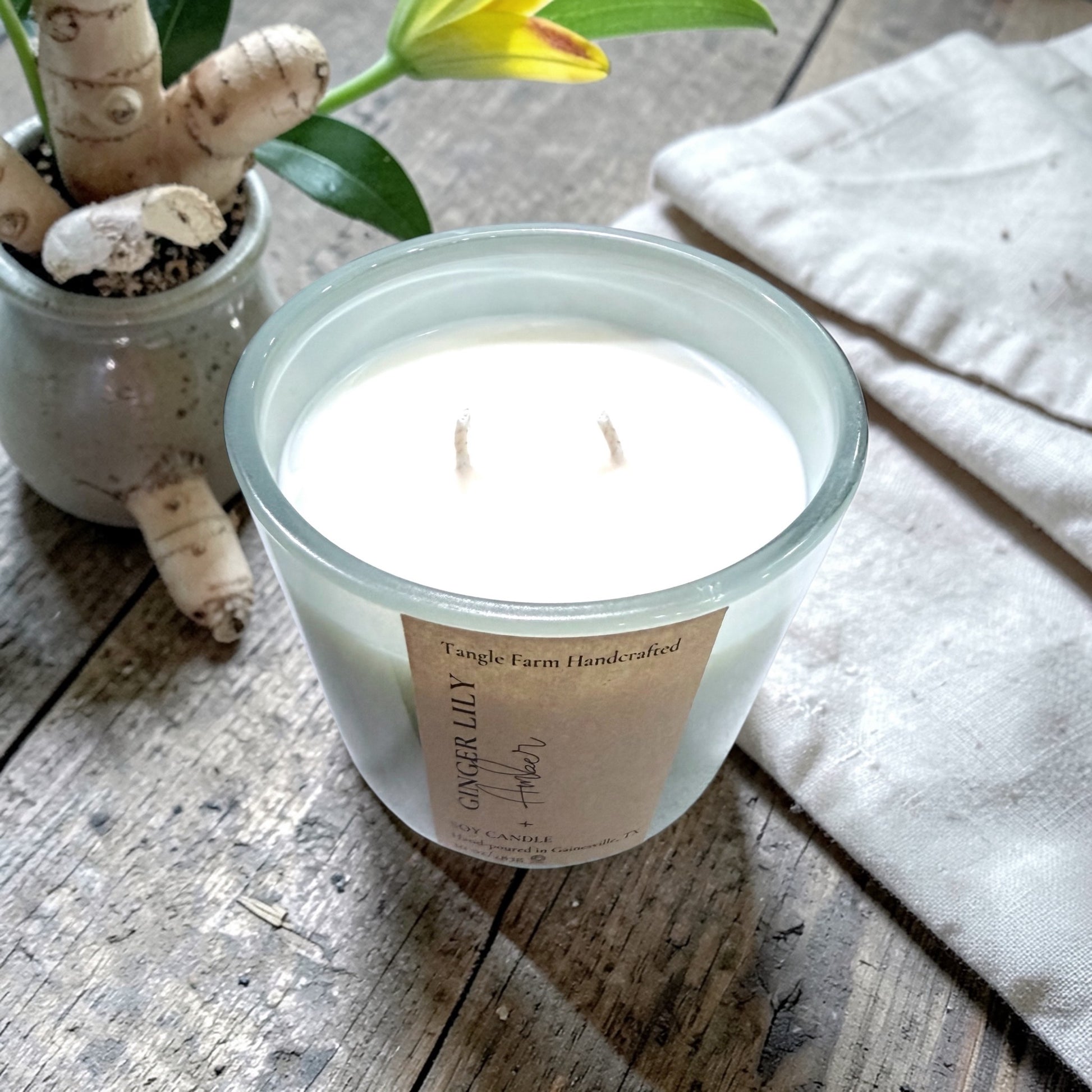 Ginger lily and amber soy candle in a colorful Serafina container, 10oz.
