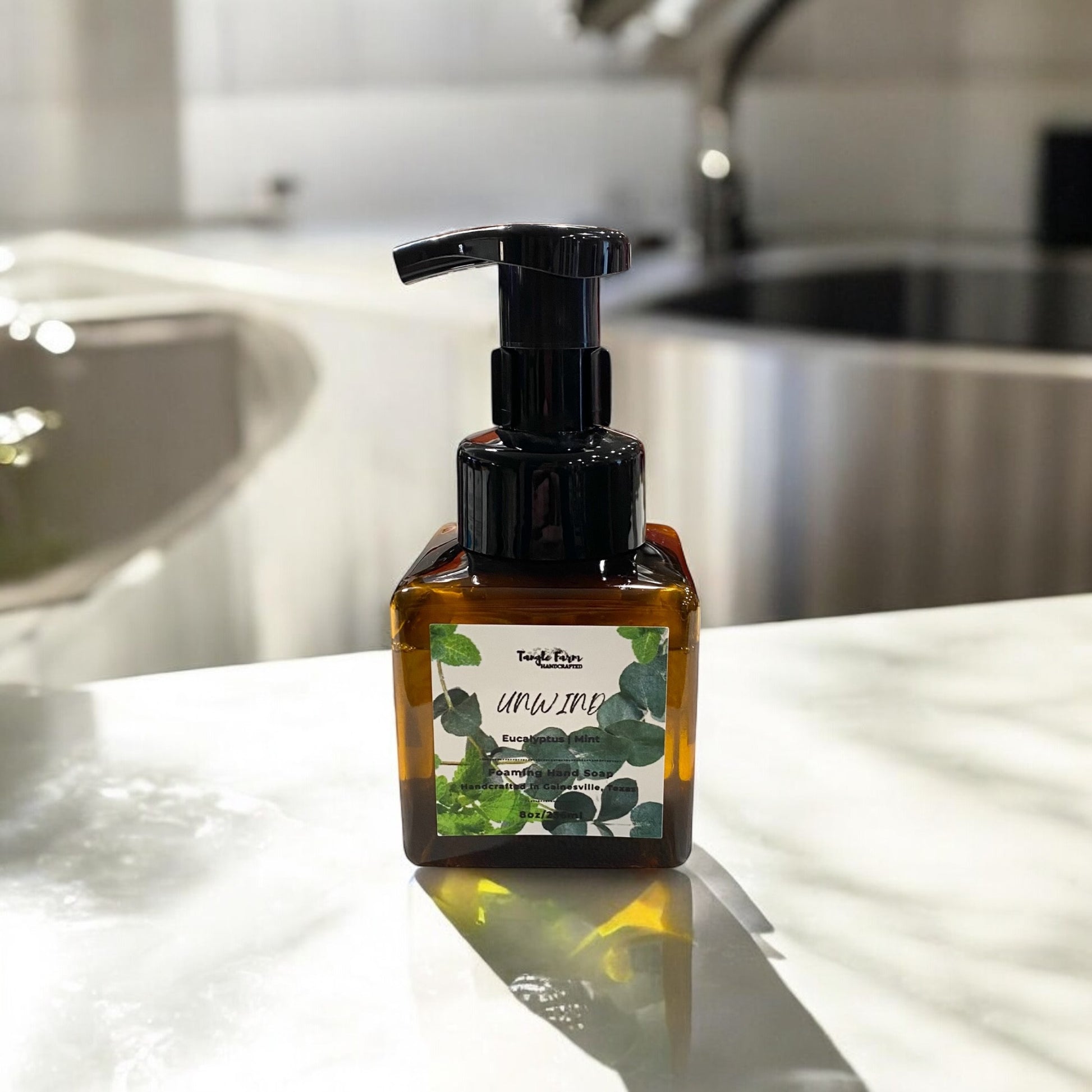 Unwind 8oz foaming hand soap scented with Eucalyptus and Mint