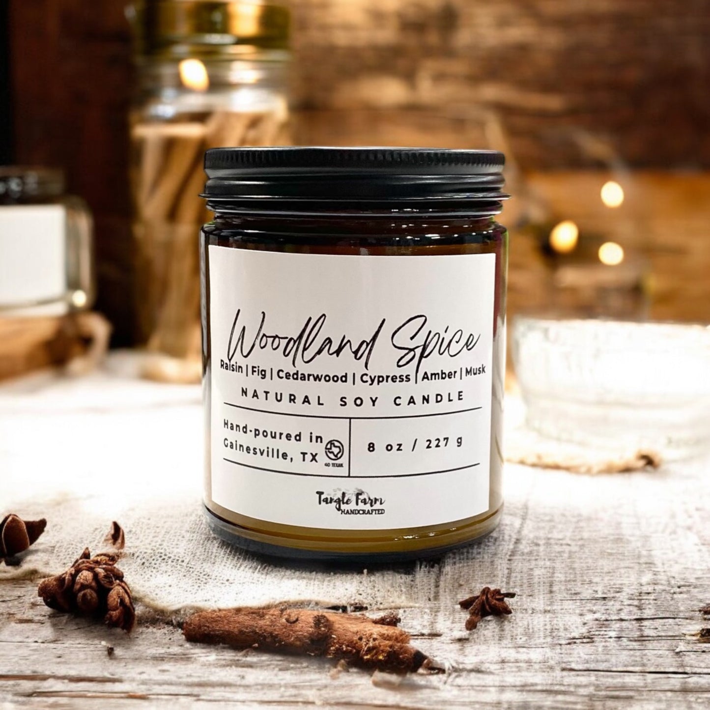 Woodland spice soy candle in amber jar with notes of raisin, fig, cedarwood, cypress and amber and musk.