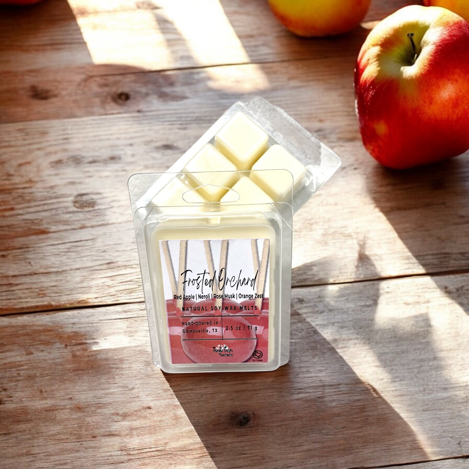 Frosted Orchard wax melt with red apple, neroli and rose musk.